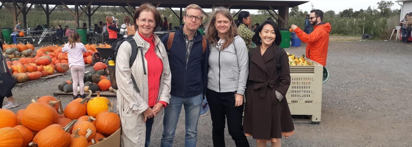 MCPD grantee Aulikki Pakanen and other visiting scholars at a pumpkin field